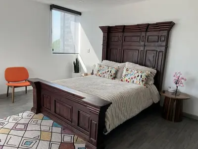 Cama o camas de una habitación en Bello Penthouse con Alberca