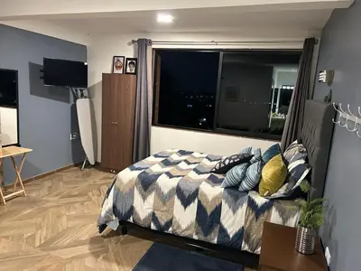 Una televisión o centro de entretenimiento en Casa Velódromo