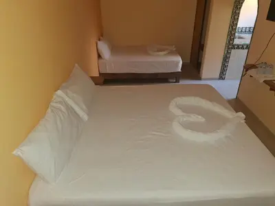 Cama o camas de una habitación en Tortuga Real Huatulco