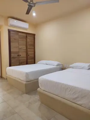 Cama o camas de una habitación en Tortuga Real Huatulco