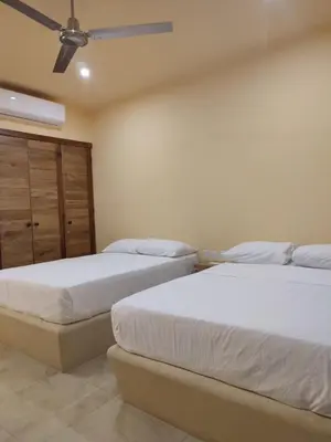 Cama o camas de una habitación en Tortuga Real Huatulco