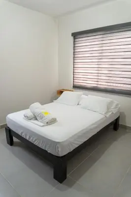 Cama o camas de una habitación en Departamento Acapulco Diamante