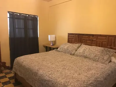 Cama o camas de una habitación en La Adornada Girasol