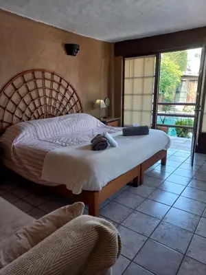 Cama o camas de una habitación en La Casa del Sol - Cuernavaca