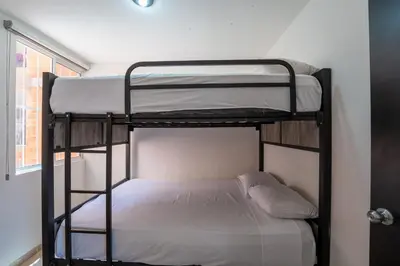 Cama o camas de una habitación en Departamento El Dorado