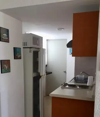 Una cocina o zona de cocina en Departamento frente a la playa