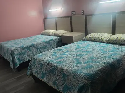 Cama o camas de una habitación en Servicios de Hospedaje