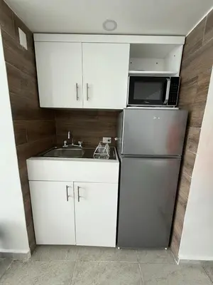 Una cocina o zona de cocina en Departamento con vista al mar y playa privada