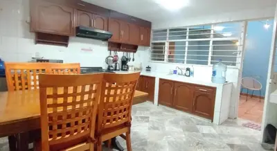 Una cocina o zona de cocina en Casa de huéspedes Chukum