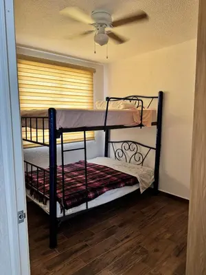 Cama o camas de una habitación en Residencial Quetzales