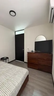 Cama o camas de una habitación en Departamento equipado a 10 minutos de la playa