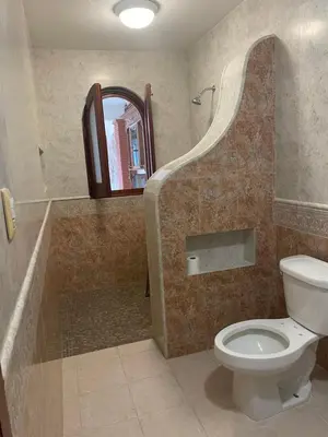 Un baño de Casa del León