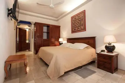 Cama o camas de una habitación en Orchidelirium Casa Hotel & Salud Estética