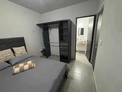 Cama o camas de una habitación en Departamento Acapulco Barra Vieja & Club de Playa