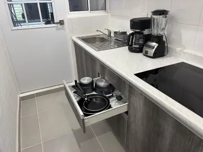 Una cocina o zona de cocina en Departamento Acapulco Barra Vieja & Club de Playa