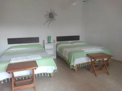 Cama o camas de una habitación en La Casa del Volcan