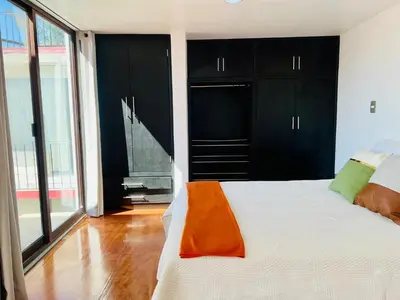 Cama o camas de una habitación en Departamento con terraza en el Centro