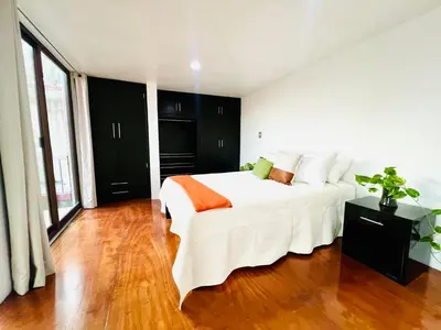 Cama o camas de una habitación en Departamento con terraza en el Centro