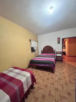 Cama o camas de una habitación en La casa de mi abuelita