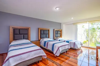 Cama o camas de una habitación en Casa en Burgos, Cuernavaca