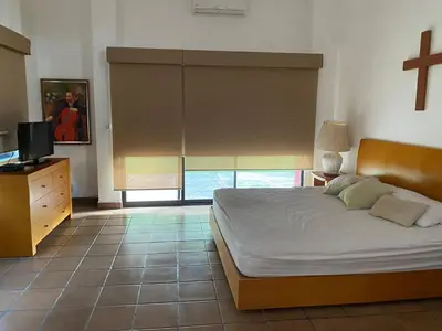 Cama o camas de una habitación en Vacation House Chamilpa