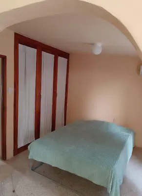 Cama o camas de una habitación en Acogedora casita en la playa