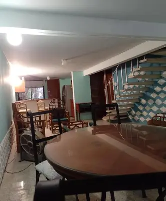 Zona de estar de Acogedora casita en la playa