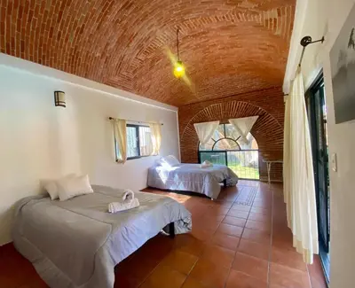 Cama o camas de una habitación en Hotel Tepetzalan