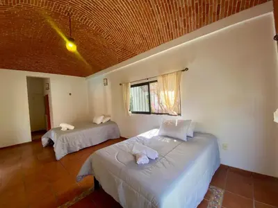 Cama o camas de una habitación en Hotel Tepetzalan