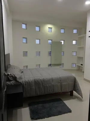 Cama o camas de una habitación en Habitación en departamento de lujo
