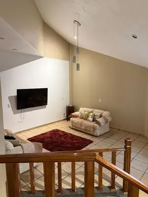 Una televisión o centro de entretenimiento en Chalets Dannis
