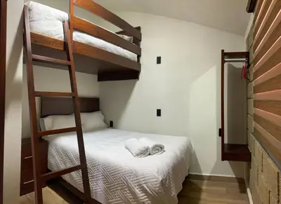 Cama o camas de una habitación en Cabañas Hacienda Real