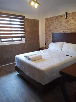 Cama o camas de una habitación en Cabañas Hacienda Real