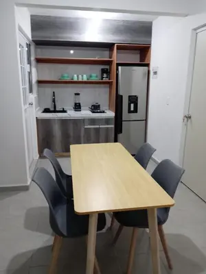 Una cocina o zona de cocina en Departamento, Refugio Diamante & Pool