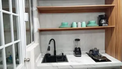 Una cocina o zona de cocina en Departamento, Refugio Diamante & Pool