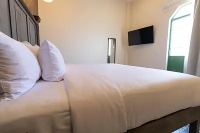 Cama o camas de una habitación en Bendito Capricho Hotel