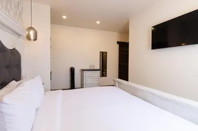 Cama o camas de una habitación en Bendito Capricho Hotel