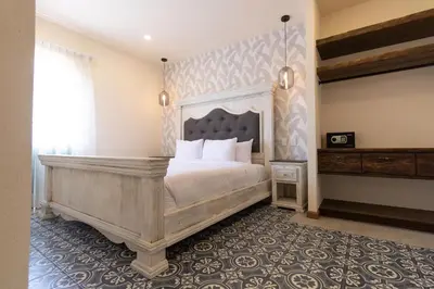Cama o camas de una habitación en Bendito Capricho Hotel