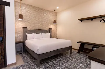 Cama o camas de una habitación en Bendito Capricho Hotel