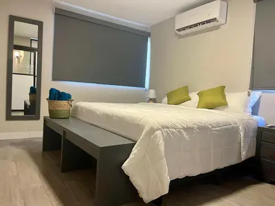 Cama o camas de una habitación en Depa Equipado Zona de Estadios & Restaurantes