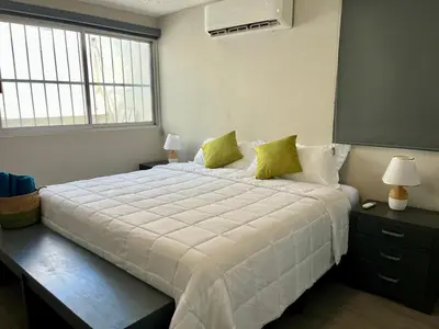 Cama o camas de una habitación en Depa Equipado Zona de Estadios & Restaurantes