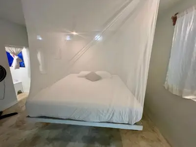 Cama o camas de una habitación en Casa con alberca y acceso directo a la playa