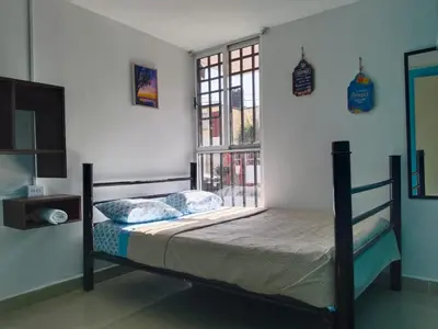 Cama o camas de una habitación en Hospedaje Casa Azul