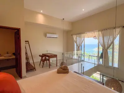 Cama o camas de una habitación en Estrella de Mar Suites