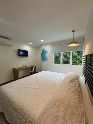 Cama o camas de una habitación en Angeles Suites & Hotel