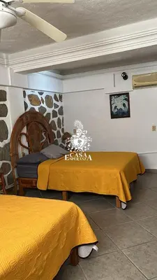 Cama o camas de una habitación en Casa Esperanza Acapulco