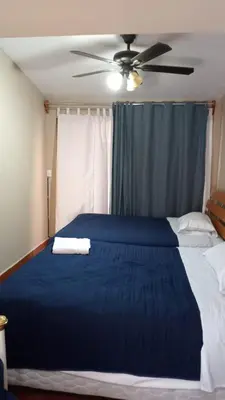 Cama o camas de una habitación en UNIVERSIDAD LATINA GUEST HOUSE CASA DE HUESPEDES a