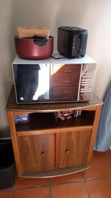 Una televisión o centro de entretenimiento en UNIVERSIDAD LATINA GUEST HOUSE CASA DE HUESPEDES a