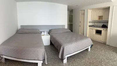 Cama o camas de una habitación en Torres gemelas - Suite equipada con vista a la bahía