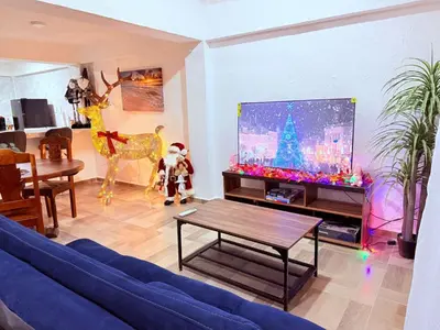 Una televisión o centro de entretenimiento en Departamento céntrico Huatulco
